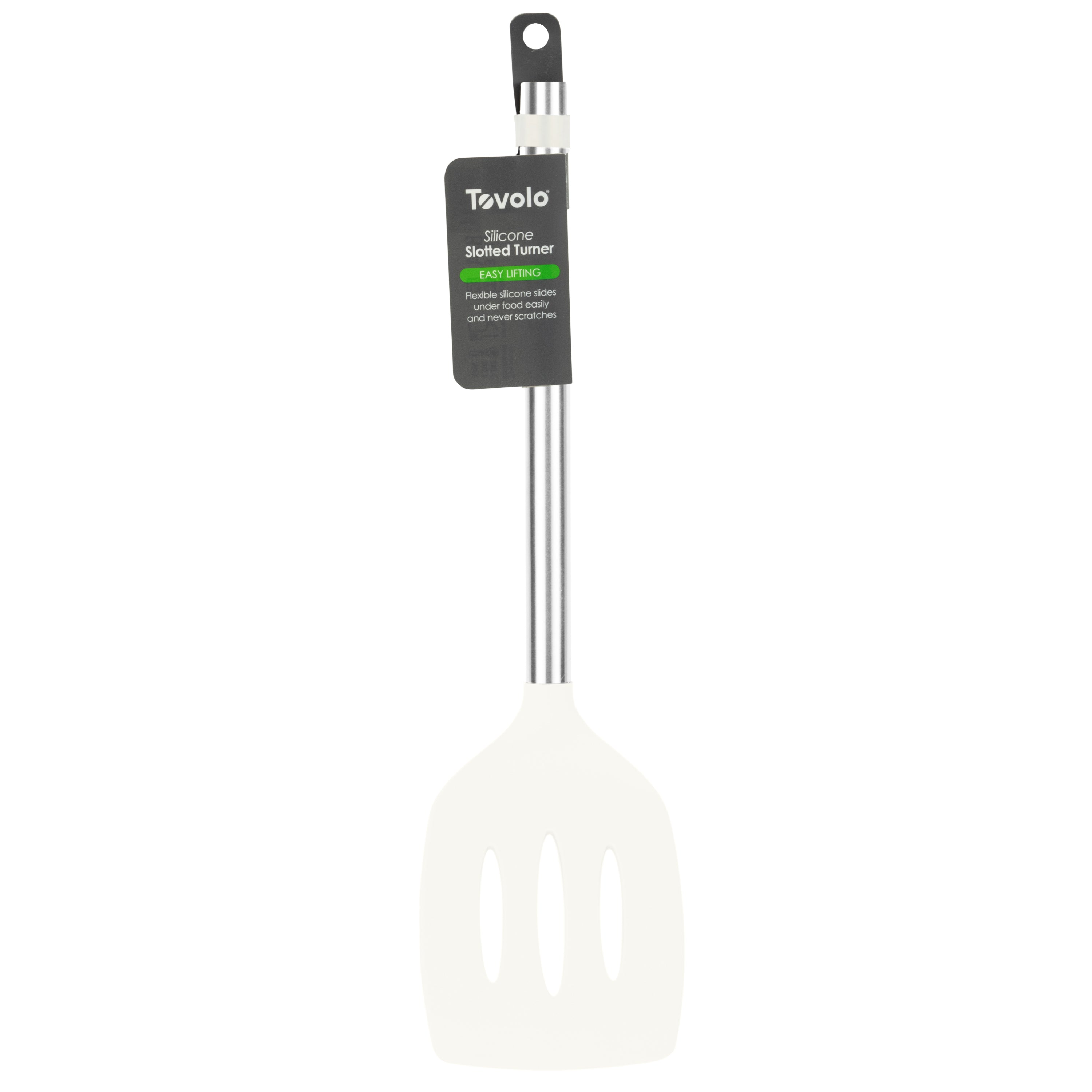 A white Silicone Slotted Turner with a stainless steel handle is nonstick safe for easy cooking. A black and green label on the handle displays “Tovolo Silicone Slotted Turner.”.