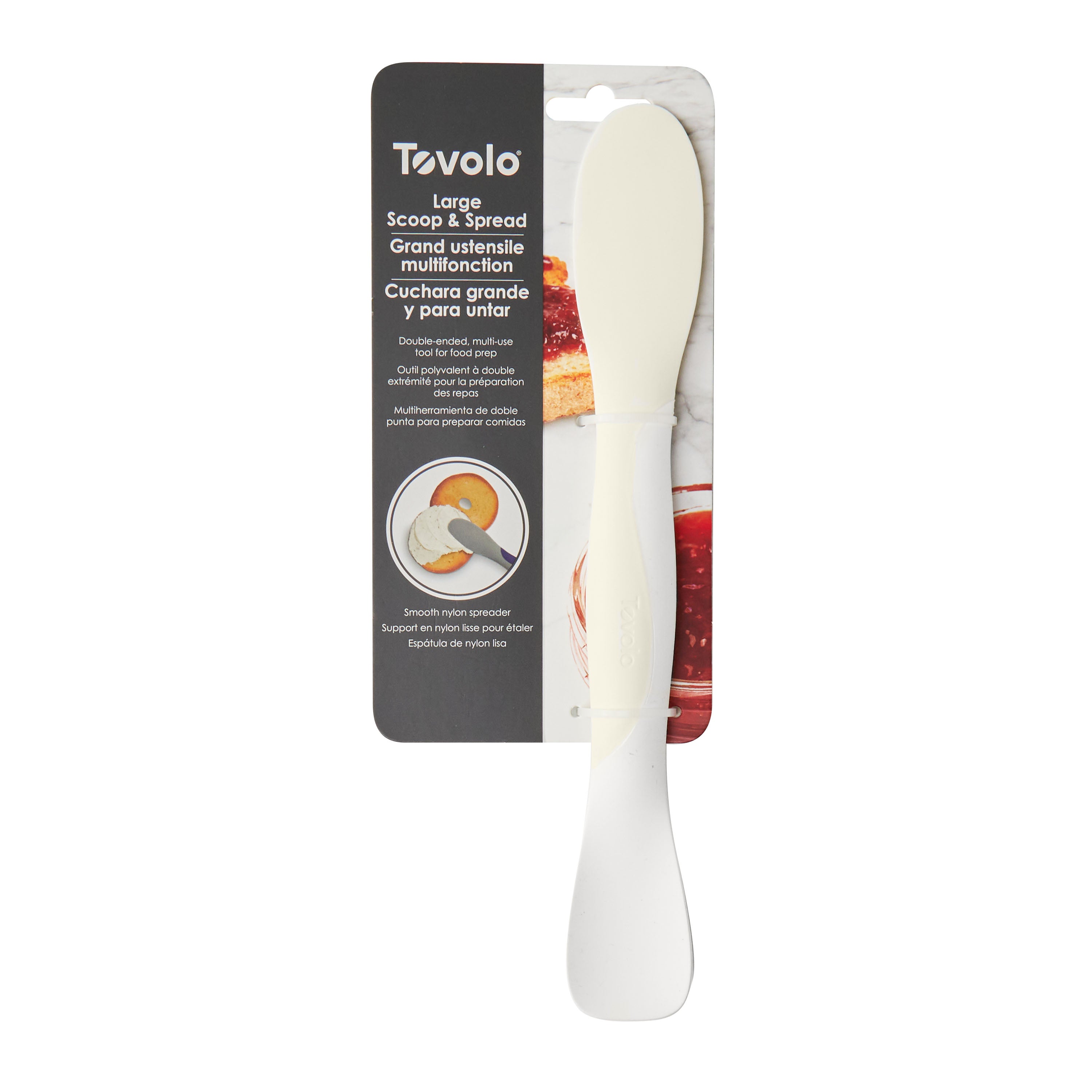 A Scoop and Spread kitchen tool in white, packed with a card showing its use on bread. Features are listed in English, French, and Spanish—making this handy baker’s tool accessible for everyone.