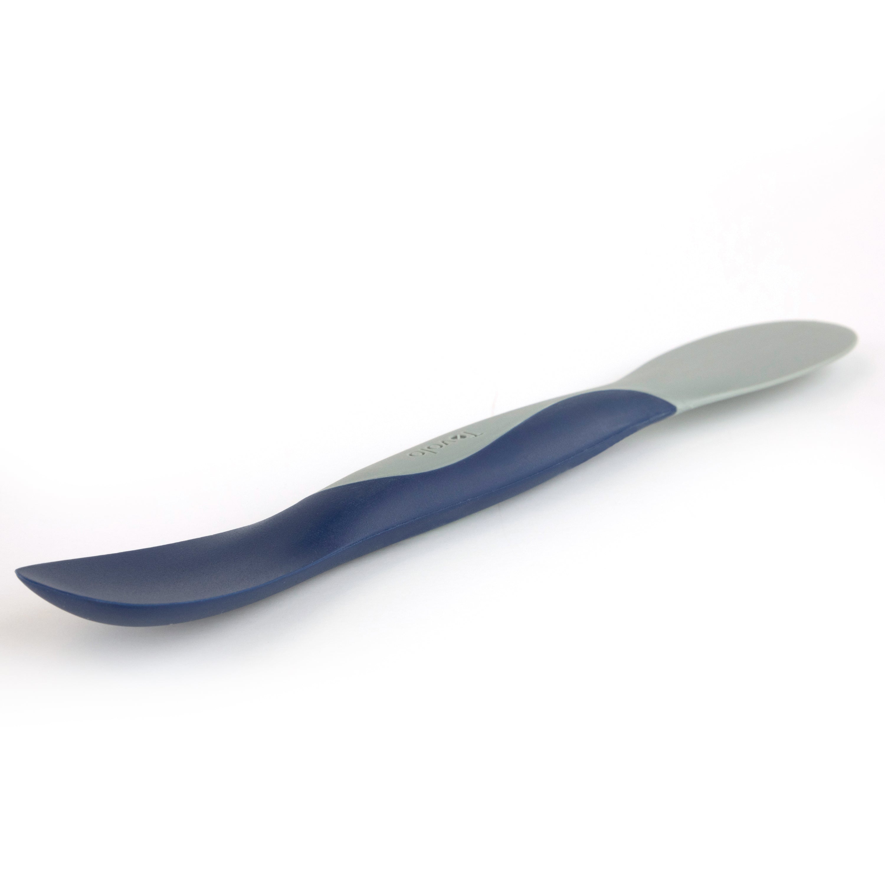 The Scoop and Spread is a two-toned kitchen tool with a blue and gray handle, featuring a rounded, scoop-and-spread spatula end and a flat, slightly curved blade, shown on a white background.