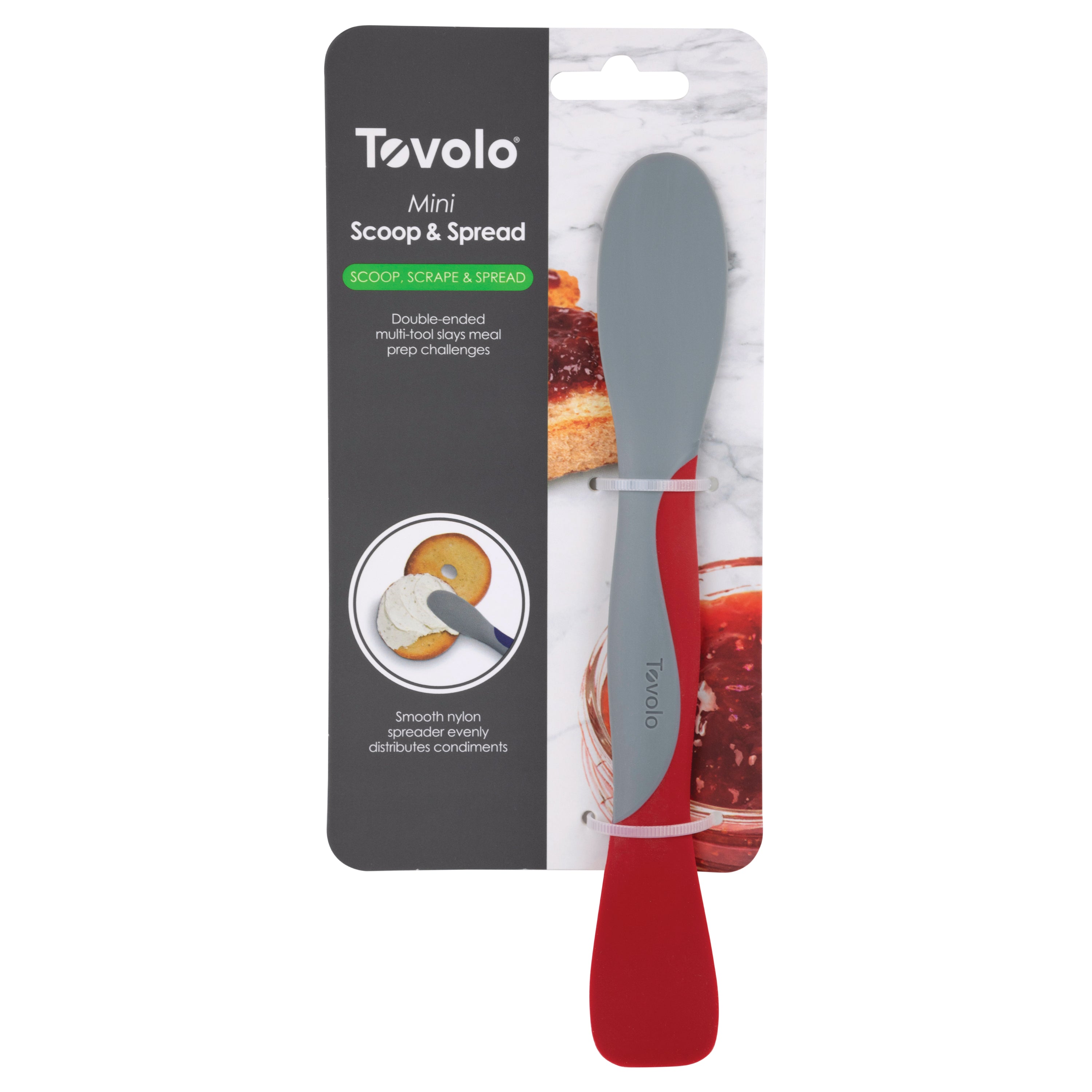 The Scoop and Spread kitchen tool comes in packaging with a gray blade and red handle. The label highlights its scoop-and-spread versatility, shown spreading jam on toast—a baker’s best friend.