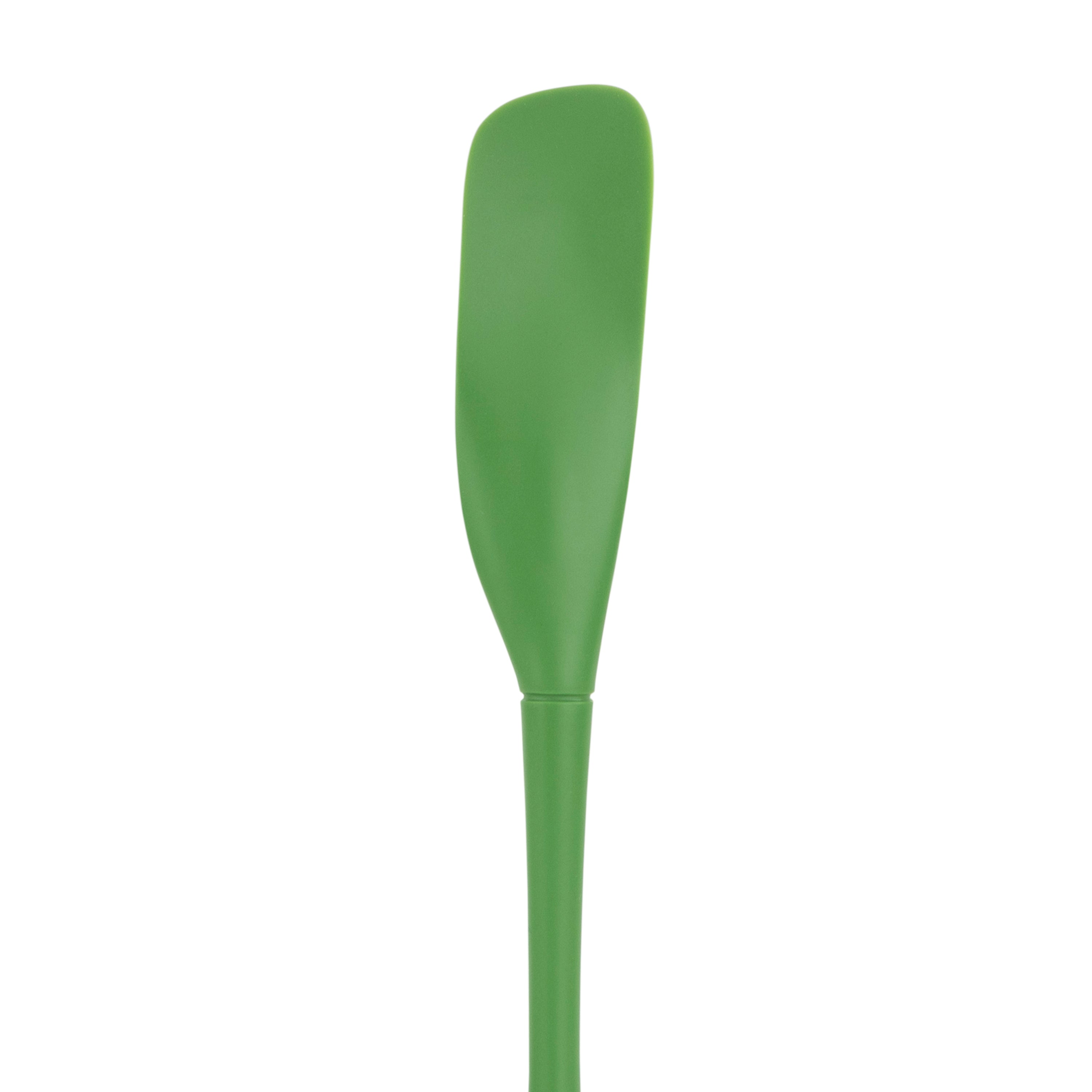 The Flex-Core Jar Scraper is a green silicone kitchen tool with a long handle and wide, curved blade, ideal for scraping jars and food prep; shown isolated on a white background.