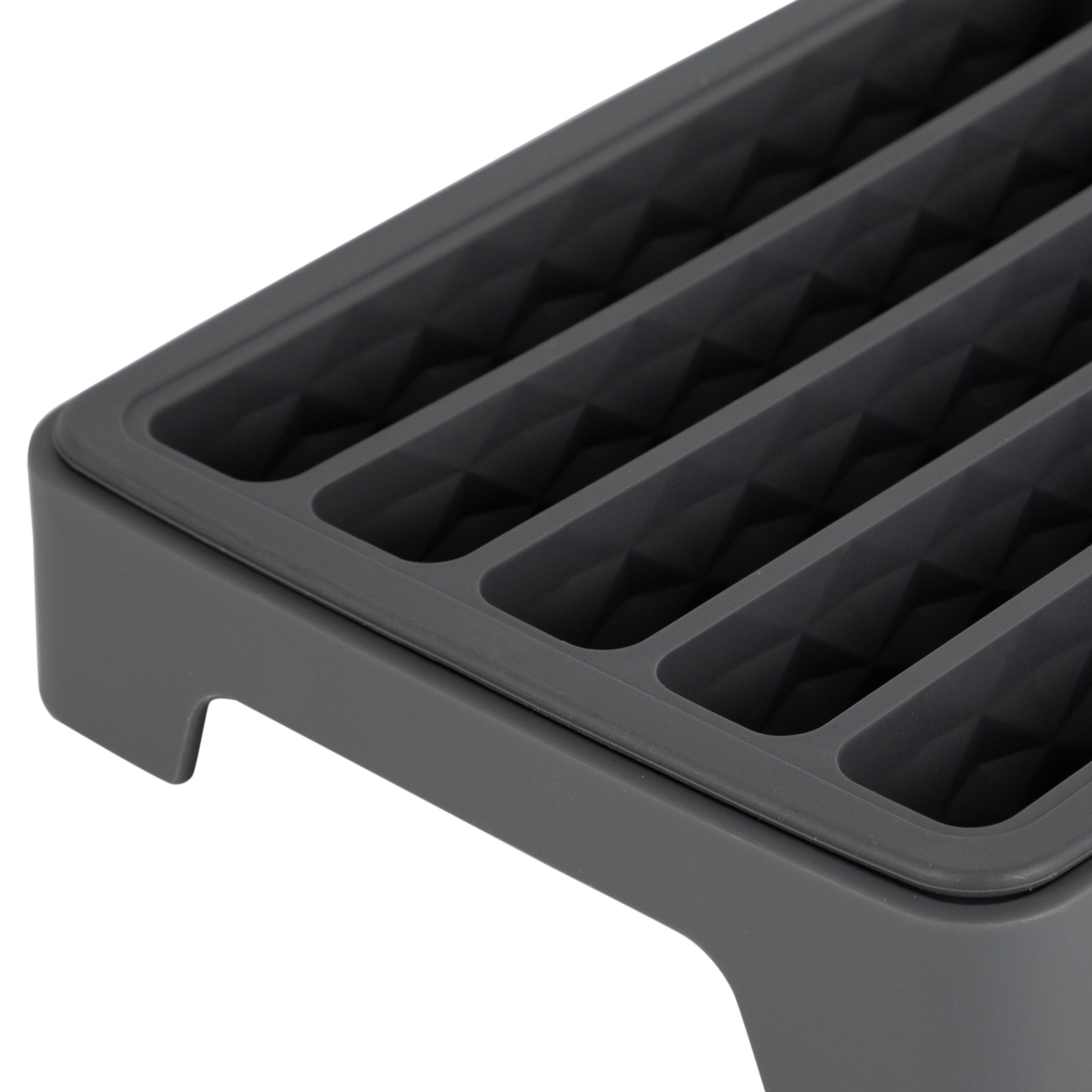 Close-up of the Water Bottle Ice Mold, featuring parallel, rectangular grooves and a raised edge—perfect for making ice cubes that fit water bottles or for organizing small items.
