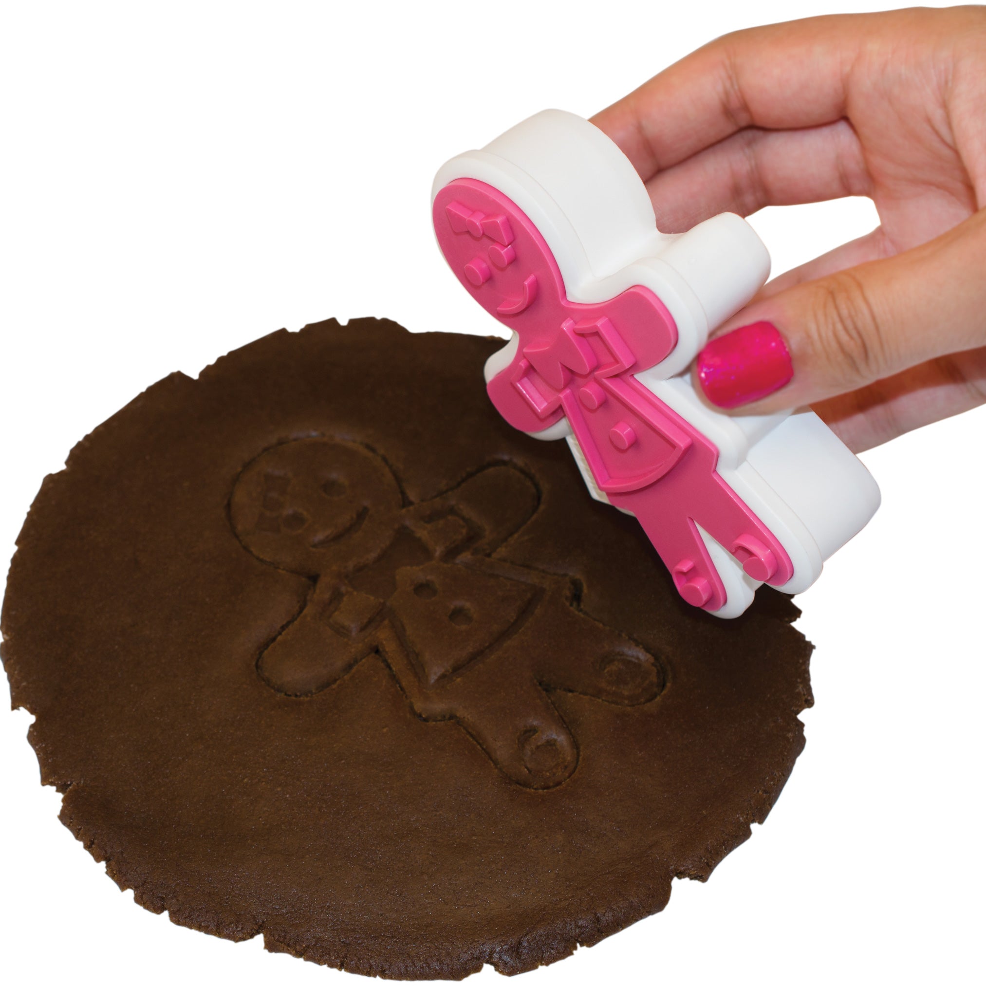 A hand with pink nail polish presses one of the Gingerbread Cookie Cutters into dark cookie dough, creating a festive imprint—ideal for winter baking and making Christmas cookies.