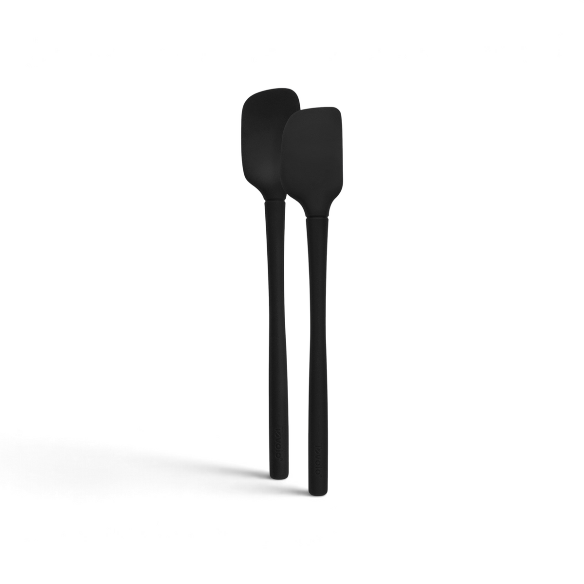 The tovolo Flex-Core Silicone Mini Spatula + Spoonula, both black and heat-resistant with long handles, are shown side by side on a white background.