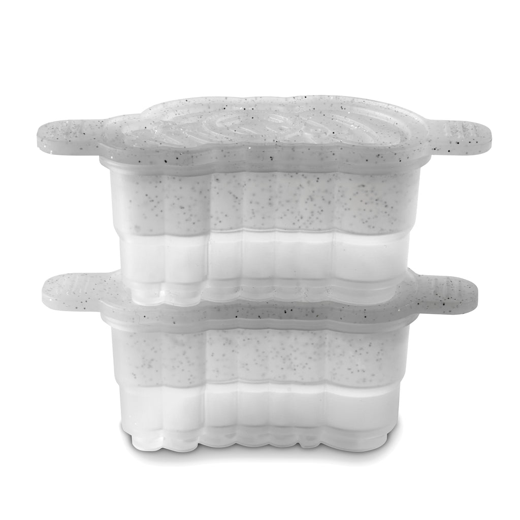 Two stacked Cheers Ice Mold containers (set of 2) by Tovolo, made of clear plastic with speckled gray lids featuring grooved sides and extended tabs, each half-filled with a white substance sprinkled with black specks.