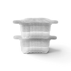 The tovolo Cheers Ice Molds (Set of 2) feature clear containers with speckled, semi-transparent lids, rounded edges, and side grips. Shown stacked, each mold is half-filled with a white substance.