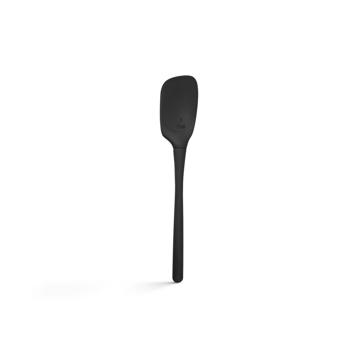 The tovolo Flex-Core Silicone Deep Spoonula is a black, heat-resistant kitchen tool with a long handle and flat, curved head marked “1 tbs,” ideal for precise measuring and versatile cooking tasks.