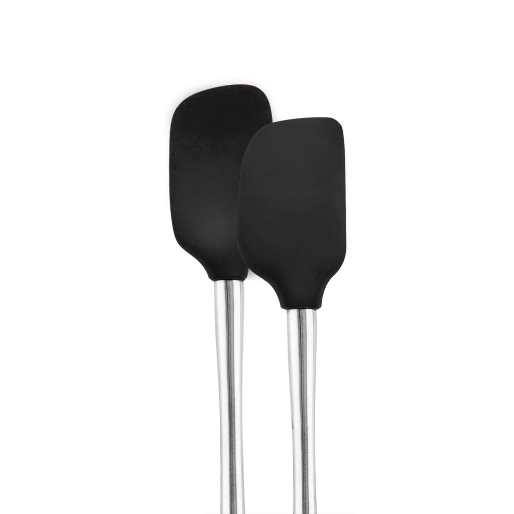 The tovolo Flex-Core Mini Spatula + Spoonula with Stainless Steel Handle, both black silicone tools, stand upright side by side against a plain white background.