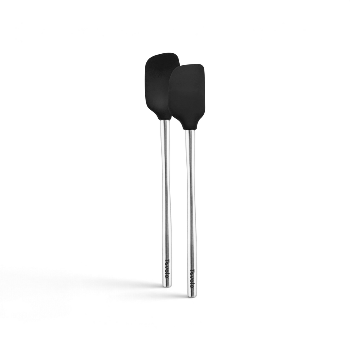The tovolo Flex-Core Mini Spatula + Spoonula with Stainless Steel Handles are shown side by side on a white background. Each black silicone tool features the tovolo logo near the end of its silver handle.