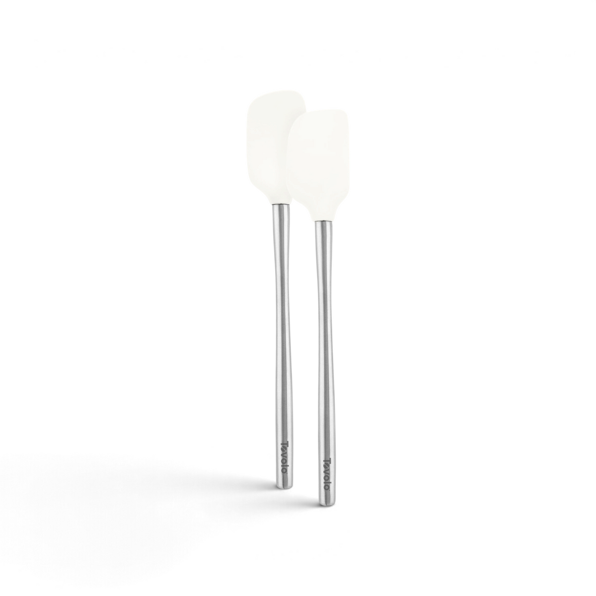 The tovolo Flex-Core Silicone Mini Spatula + Spoonula set features two white, heat-resistant utensils with long silver handles, displayed side by side against a white background.