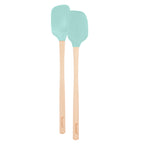 The Flex-Core Mini Spat + Spoonula set includes two light blue silicone utensils with long wooden handles engraved with "Tovolo," shown side by side on a white background. Both pieces are heat-resistant and perfect for kitchen use.