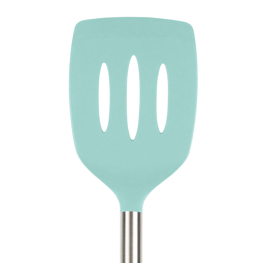 The tovolo Silicone and Stainless Steel Slotted Turner features a light blue silicone head with three oval slots, a stainless steel handle, and is safe for nonstick cookware. Shown against a white background.