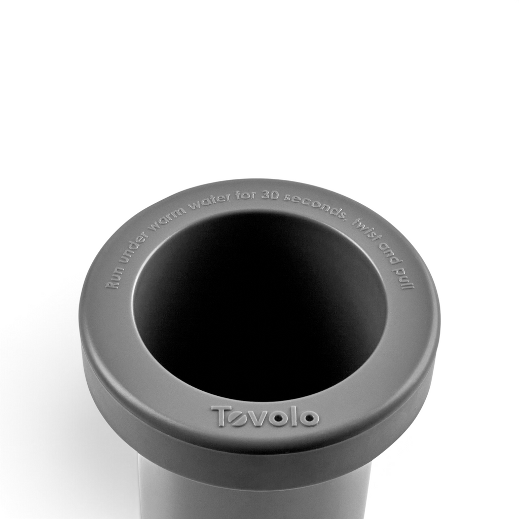 Tovolo Squeeze & Release mini ice cylinder with instructions embossed on the grey silicone rim