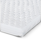 Close-up of a translucent, textured plastic surface with a diamond pattern—like on the tovolo Twist and Release Mini Ice Set tray—viewed at an angle against a white background.