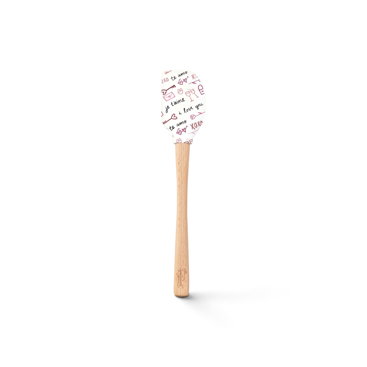 The Spring Spatulart features a wood handle and a white silicone head decorated with red and black handwritten "I love you," "te amo," hearts, and XOXO—perfect for adding a touch of love to your baking.