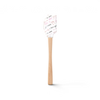 The Spring Spatulart features a wood handle and a silicone head decorated with pink and black romantic doodles and sweet phrases like "ti amo," "XOXO," and "I love you"—perfect for adding love to your kitchen creations.