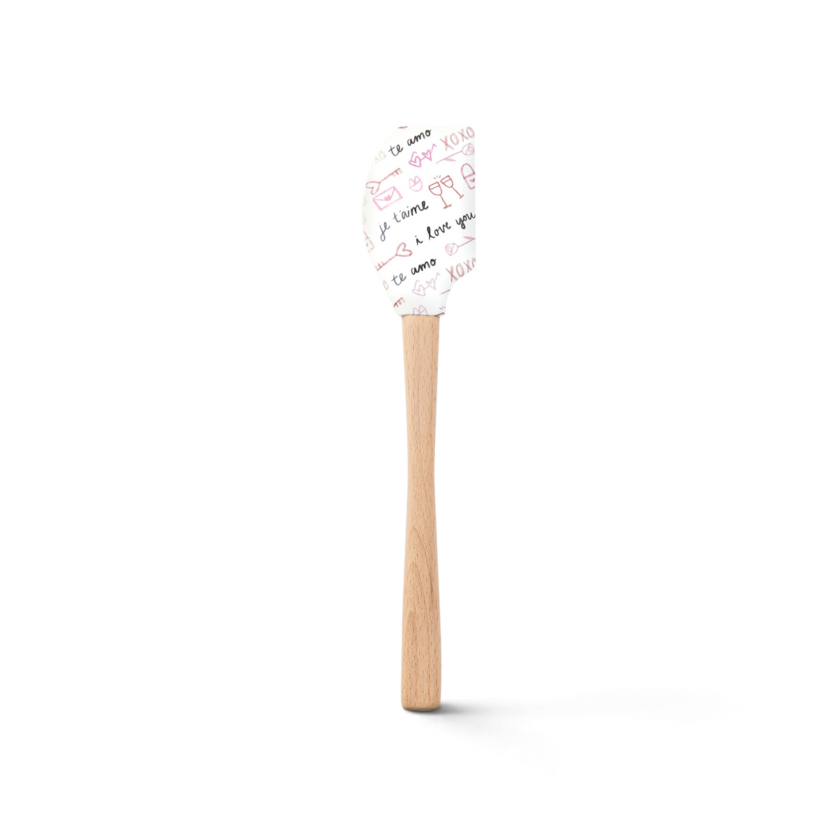 The Spring Spatulart features a wood handle and a silicone head decorated with pink and black romantic doodles and sweet phrases like "ti amo," "XOXO," and "I love you"—perfect for adding love to your kitchen creations.