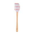 The Summer Spatulart features a durable white silicone head with red, blue, and black stripes and a wood handle engraved at the base. Set on a plain white background, this kitchen utensil blends style and function.