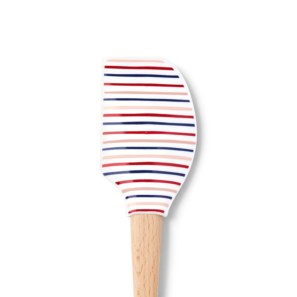 The Summer Spatulart is a wood-handled spatula with a silicone head featuring red, navy blue, and light pink stripes on white—combining style and durability for all your kitchen needs.