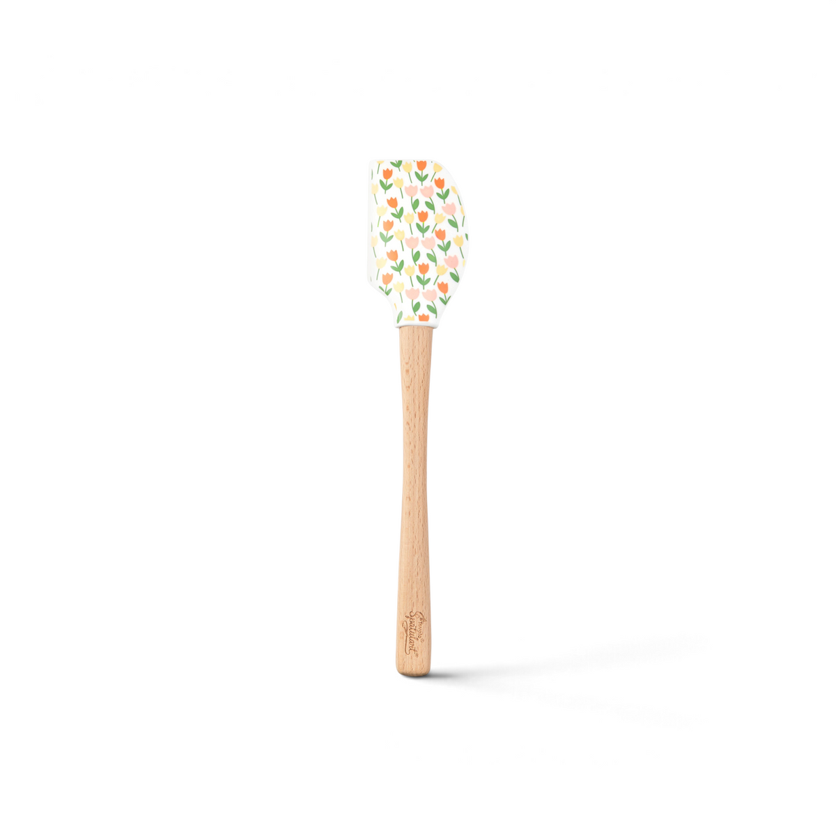 The Spring Spatulart is a wood-handled silicone spatula featuring a carrot patch design, with orange and yellow tulips and green leaves on the spatula head.