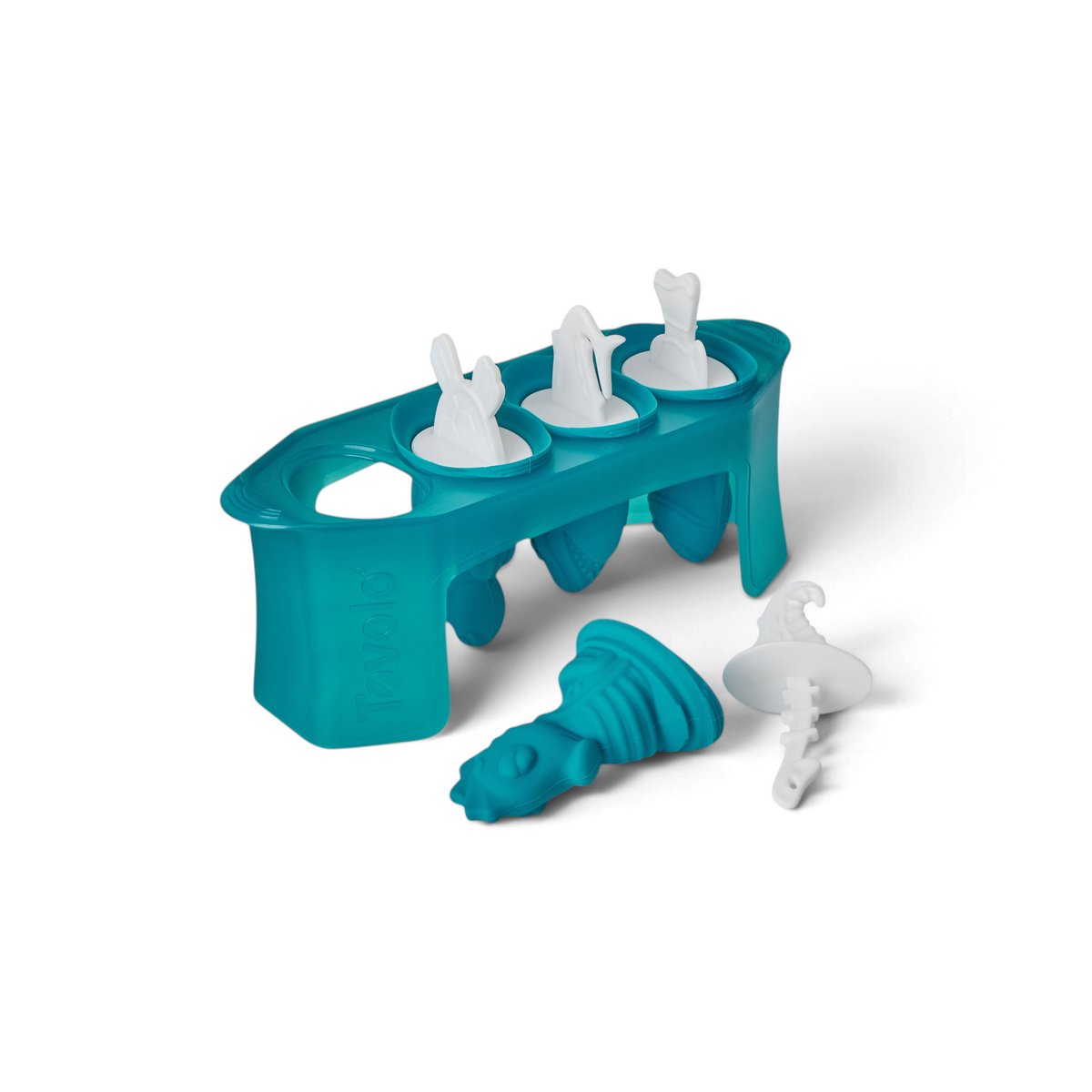 The Pop Molds set includes a teal silicone slim tray with three popsicle molds. Each mold has a white handle shaped like a shark, dolphin, or fish tail, and one popsicle with a crocodile head handle is displayed in front.