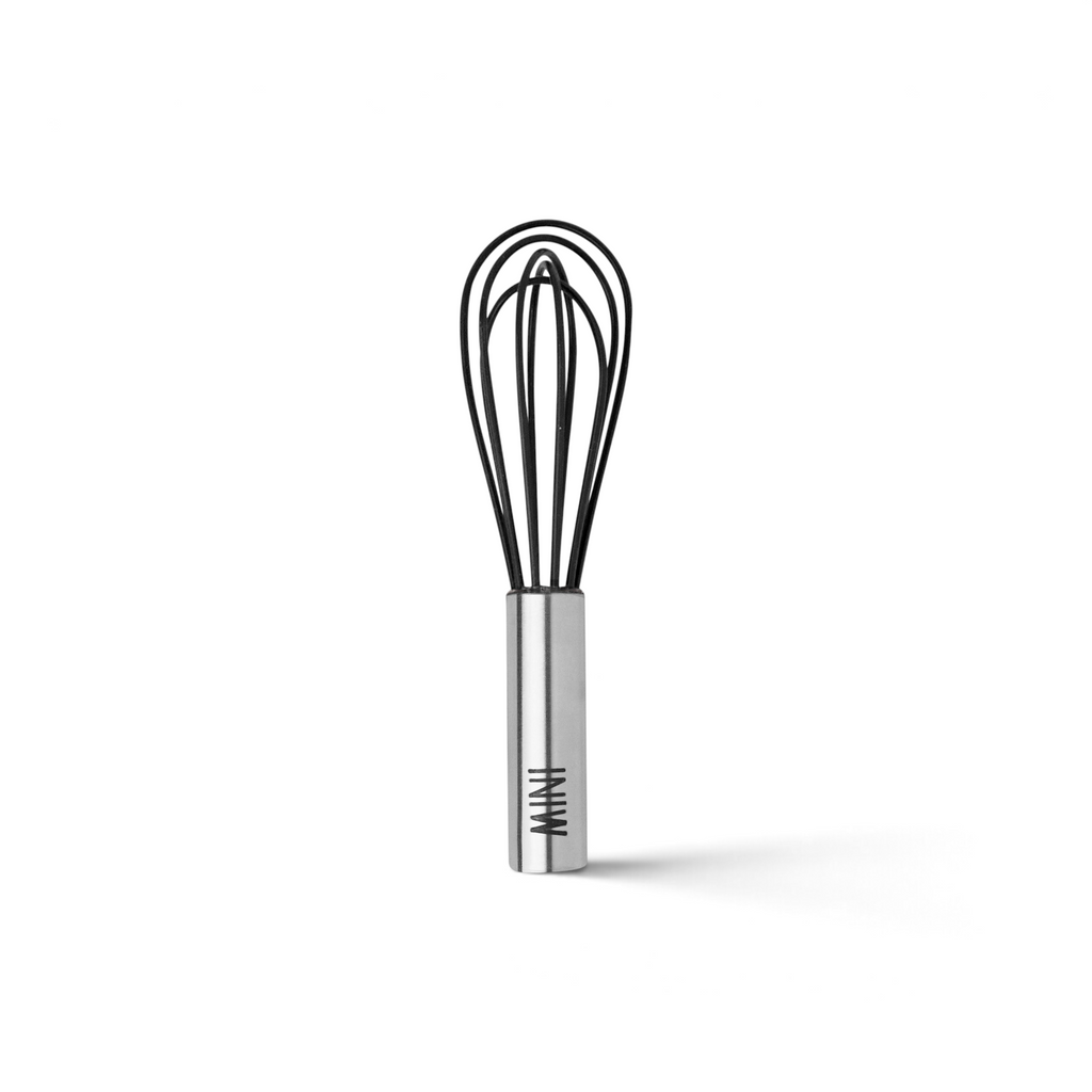 The Mini Whisk features a stainless steel handle and black wires, labeled "MINI." Shown vertically on a white background, it's ideal for quick whisking tasks.