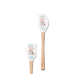 The Kitchen Hacks Spatulart set includes two wood-handled silicone spatulas adorned with books, a cup, glasses, and "MY WEEKEND IS BOOKED & BAKED"—ideal for book lovers and perfect for handy baking conversions.