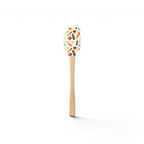 The Spring Spatulart features a wood handle and silicone head decorated with a vibrant carrot patch of tomatoes, carrots, cucumbers, and herbs on a crisp white background.