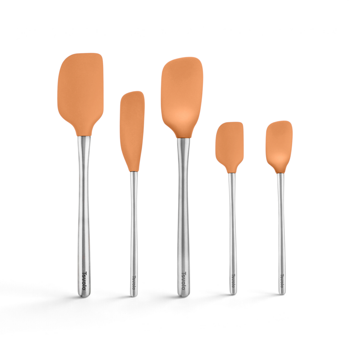 The Flex-Core All-Silicone Spatula Set of 5 features orange spatula heads and stainless steel handles, arranged upright from largest to smallest. Includes a Classic Spatula and Jar Scraper, each handle marked with the Tovolo brand.