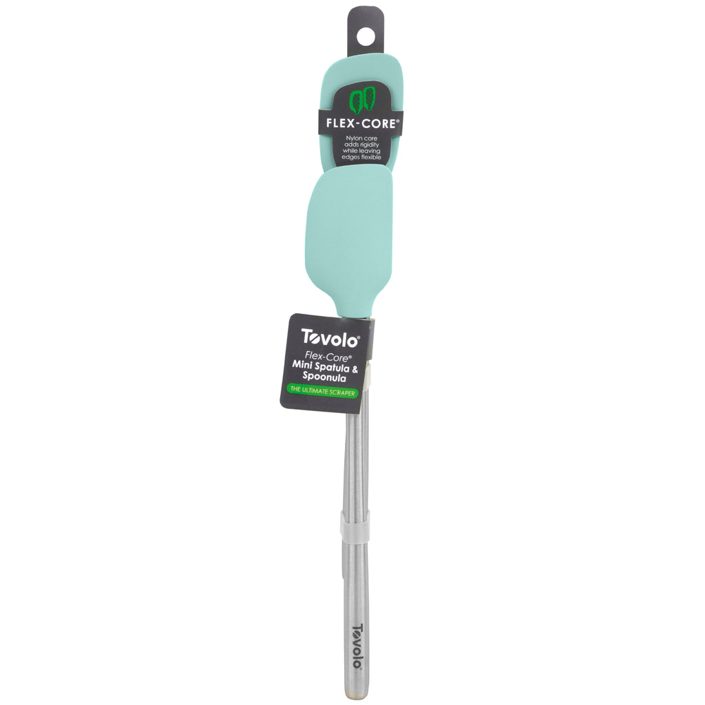 A teal tovolo Flex-Core Mini Spatula + Spoonula set features heat-resistant silicone heads and stainless steel handles, attached to packaging with product branding and descriptions.