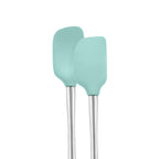 Two aqua blue tovolo Flex-Core Mini Spatula + Spoonula, with stainless steel handles, stand upright side by side against a white background.