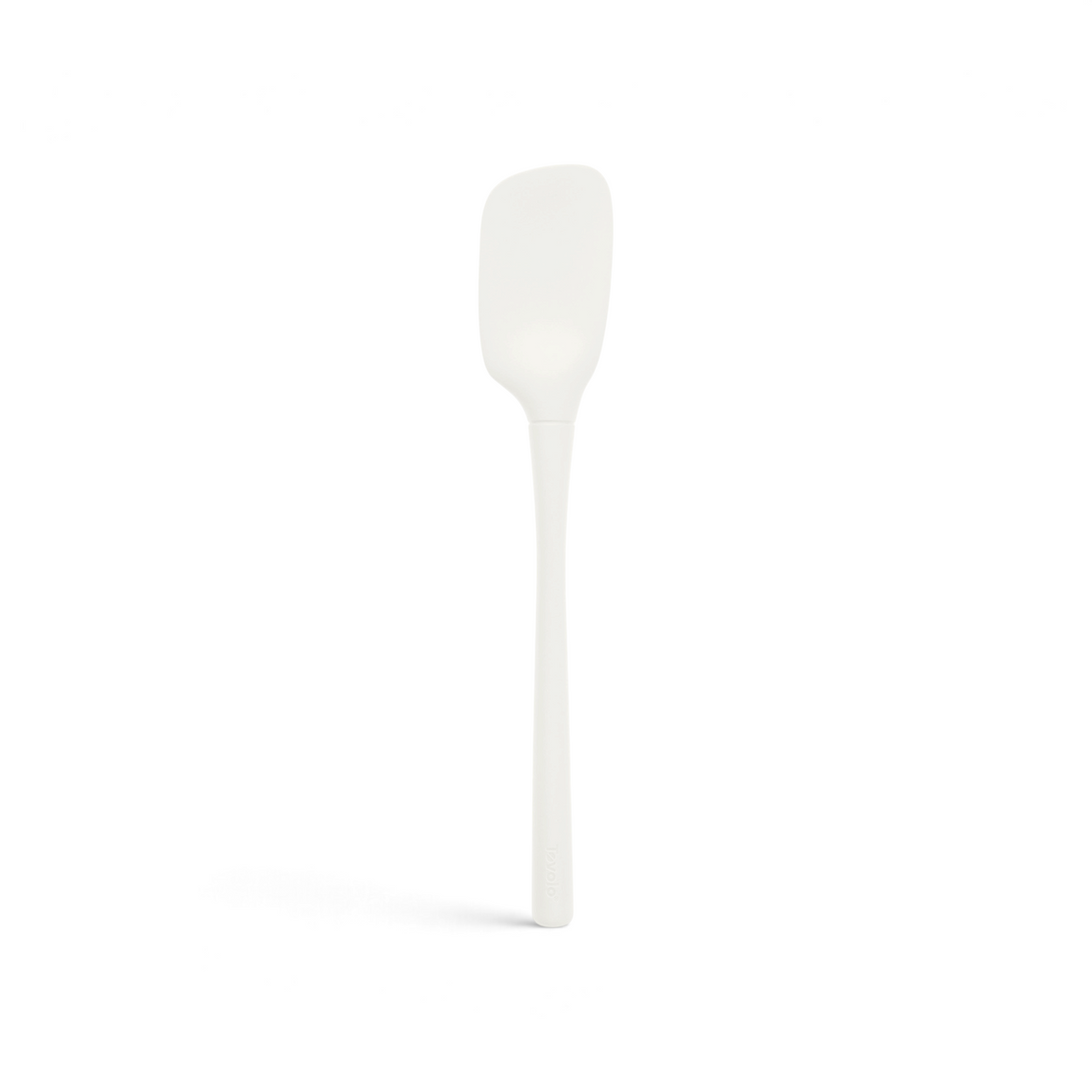 The tovolo Flex-Core Silicone Spoonula, shown on a plain white background, features a white silicone design with a long handle and a slightly curved, rectangular head.