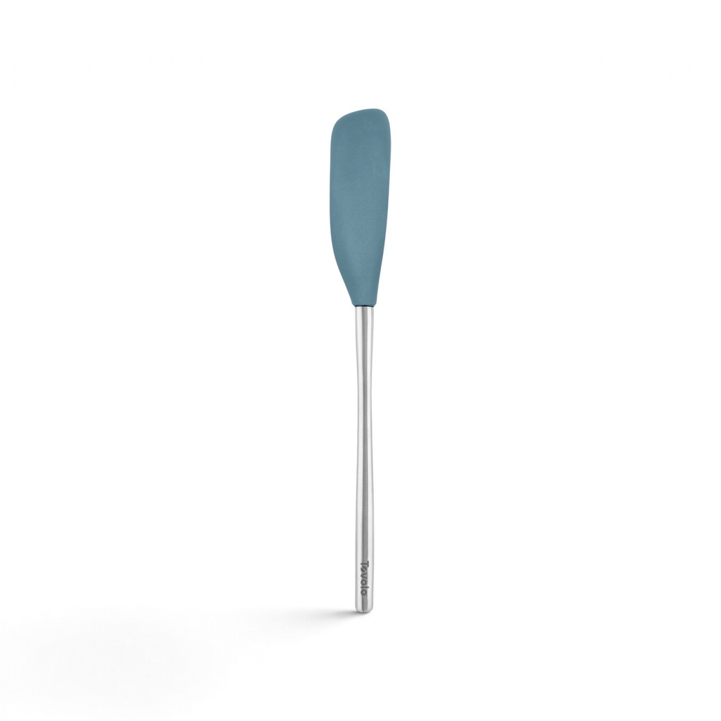 The tovolo Flex-Core Silicone Jar Scraper features a long metal handle and a blue, rounded silicone head—ideal for scraping jars. This versatile kitchen tool is displayed against a white background.