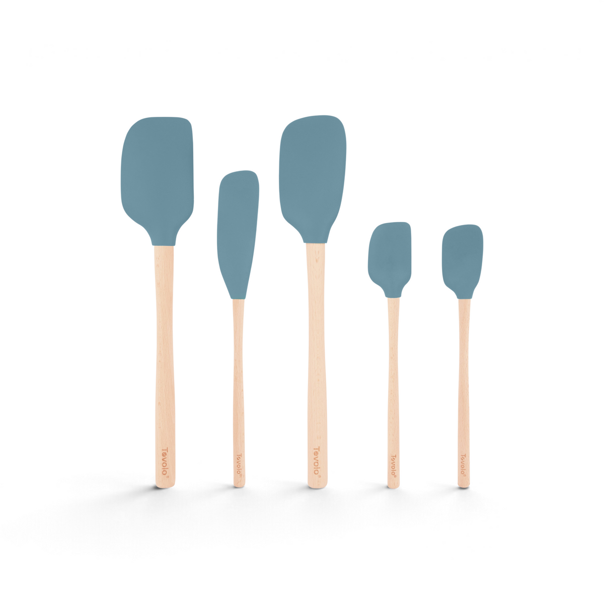 The Flex-Core Wood-Handle Spatula Set of 5 features blue-gray spatula heads and light wood handles marked with Tovolo, arranged from largest to smallest—a classic addition to any kitchen.