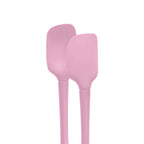 The tovolo Flex-Core Silicone Mini Spatula and Spoonula, both pink and heat-resistant, stand upright side by side against a white background.