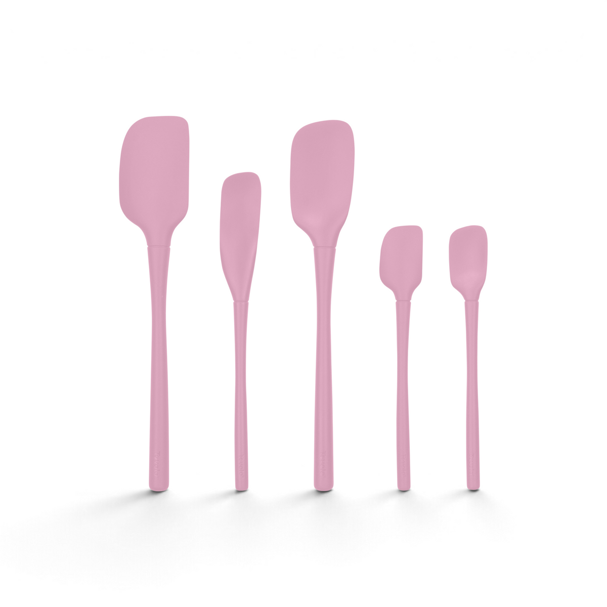 The Flex-Core All-Silicone Spatula Set of 5, featuring various sizes including a Classic Spatula and a Jar Scraper, stands upright in a row against a white background.