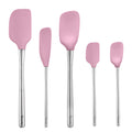 The Flex-Core All-Silicone Spatula Set of 5 features pink spatulas with silver handles in various sizes and shapes, including a Classic Spatula and Jar Scraper, displayed upright in a row on a white background.