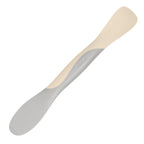 The Scoop and Spread is a versatile kitchen tool with dual ends—one flat, one rounded—for scooping and spreading. Its light grey and cream two-toned design makes it essential for every baker.