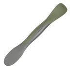 The Scoop and Spread is a double-ended kitchen tool in gray and olive green, shown on a white background. With a broad, flat end for scooping and spreading and a narrower opposite end, it’s the perfect helper for bakers.