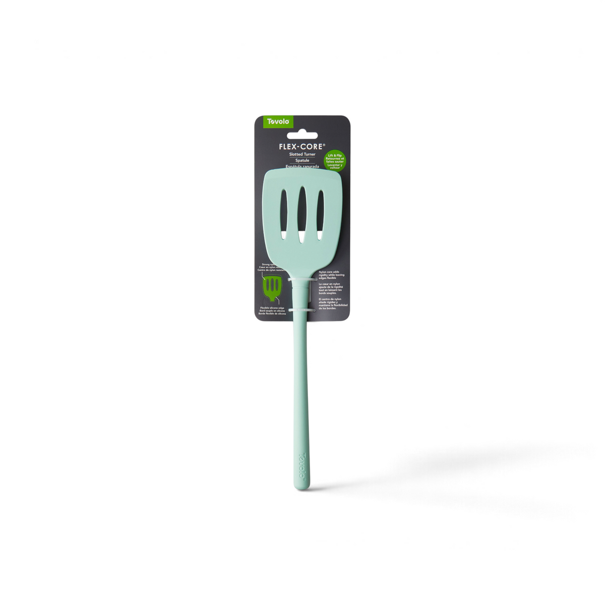 The tovolo Flex-Core Silicone Slotted Turner, in light green with a long handle, is shown in its packaging that notes it's safe for nonstick cookware and displays a small fork image.