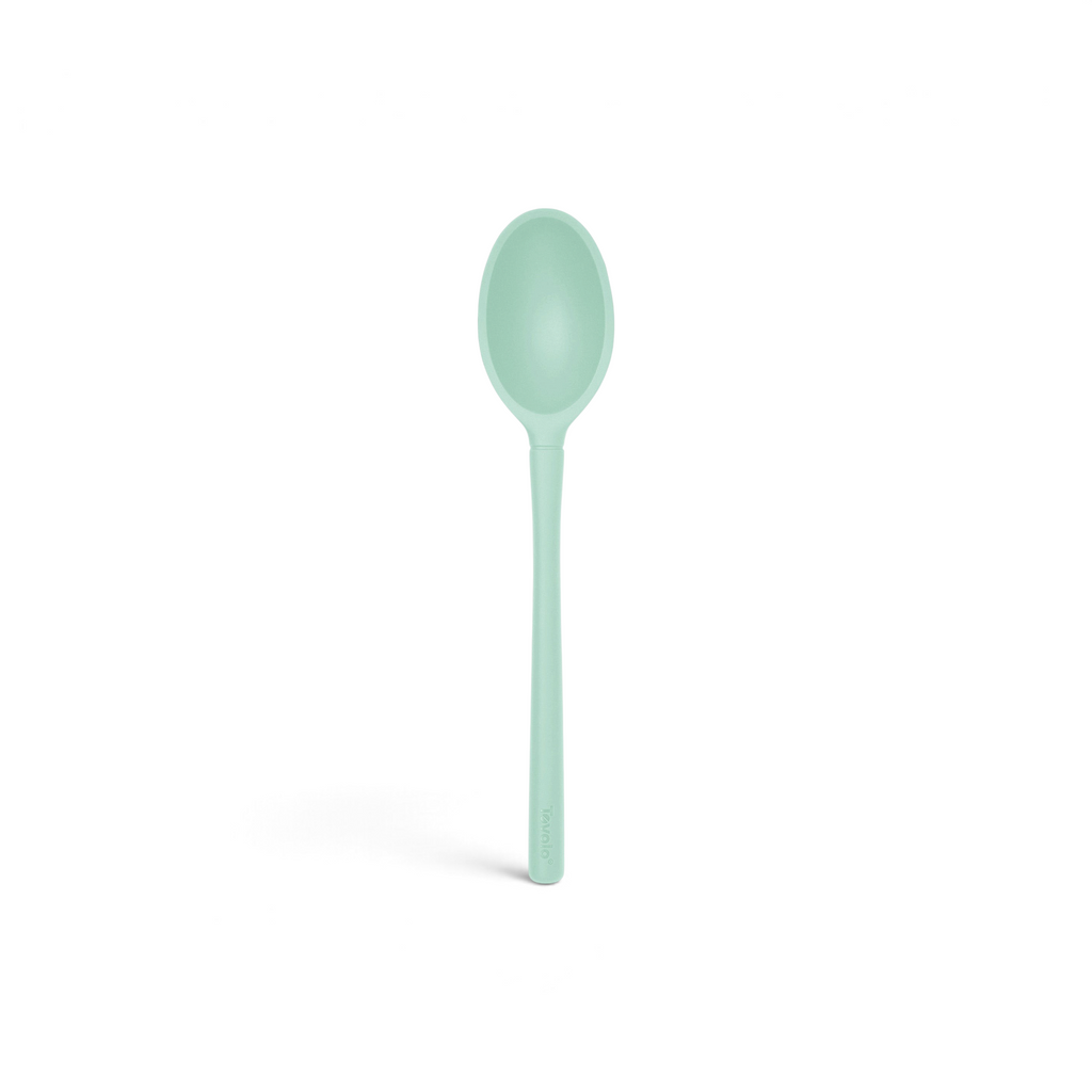 The tovolo Flex-Core Silicone Deep Spoon features a mint green color, an oval-shaped bowl, and a long handle; it is shown against a white background.