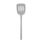 The tovolo Flex-Core Silicone Slotted Turner is shown against a white background. Featuring three slots and a curved edge, its long handle and flexible head make it ideal for use with nonstick cookware.