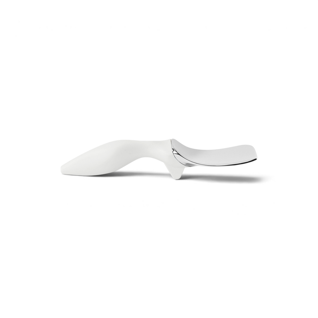 The Tilt Up Ice Cream Spade features a modern, ergonomic zinc alloy design with a shiny silver scoop blade and a white tilt-up handle, displayed against a white background.