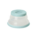 The Collapsible Microwave Food Cover is a light blue and clear, high heat-resistant plastic cover with ventilation holes on top, shown upside down against a white background.