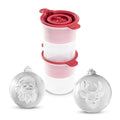 Two tovolo Santa and Reindeer Ornament Ice Molds (Set of 2), white and spherical with raised festive designs, are shown in front of two stacked clear plastic containers with red lids.