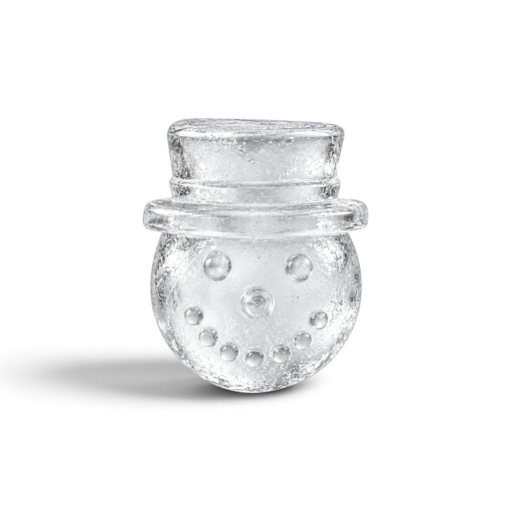 Tovolo snowman ice mold in the shape of a festive character wearing a top hat for holiday cocktails