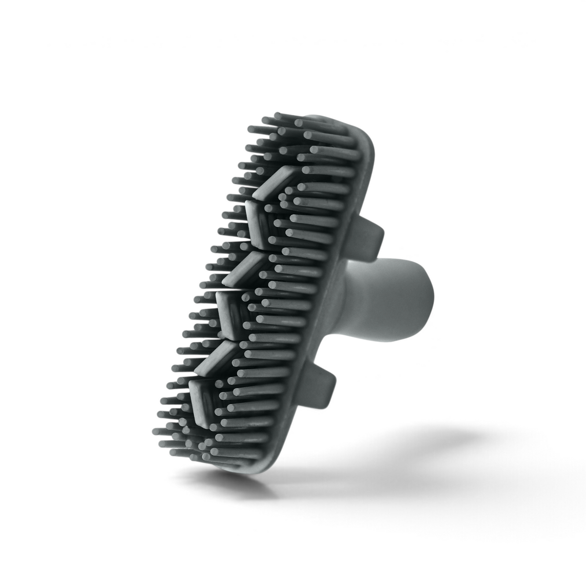 The Flex-Core Basting Brush is a gray rubber brush attachment with long, flexible bristles and a handle, displayed against a white background.