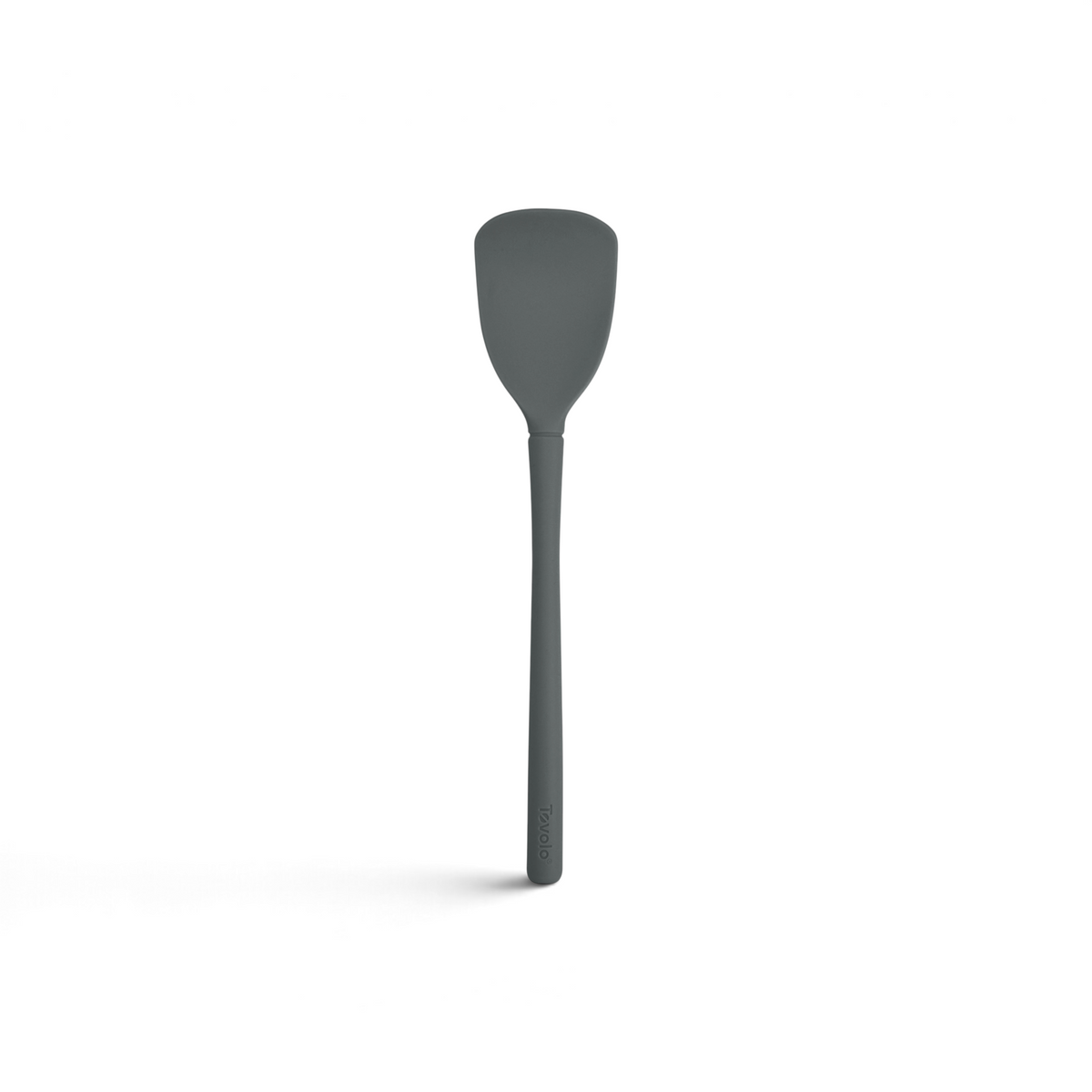 The Flex-Core Scoopula is a gray silicone spatula featuring a broad, flat head and a long handle, pictured against a white background.
