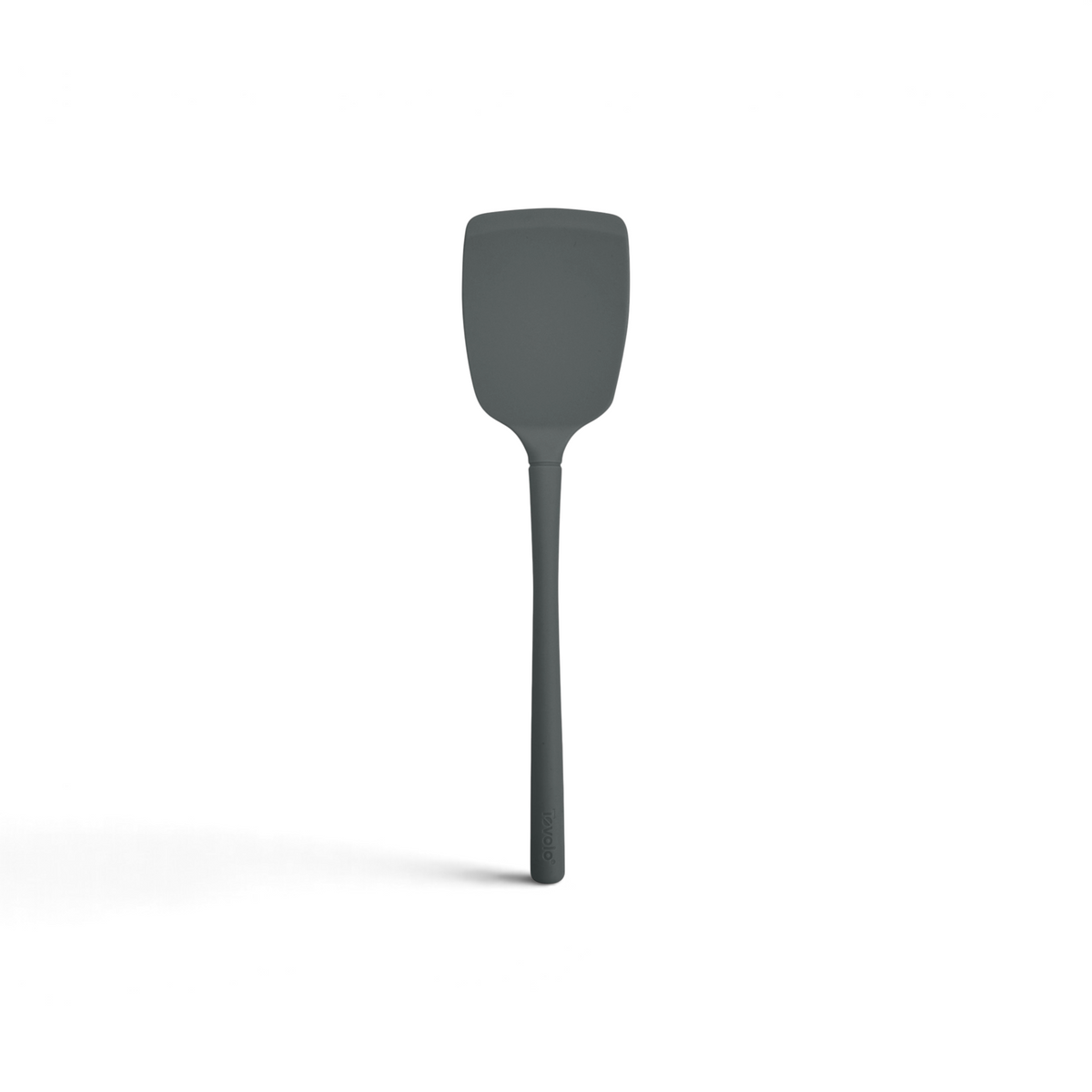 The tovolo Flex-Core Silicone Solid Turner features a gray, flat rectangular head and a long handle, displayed against a white background.