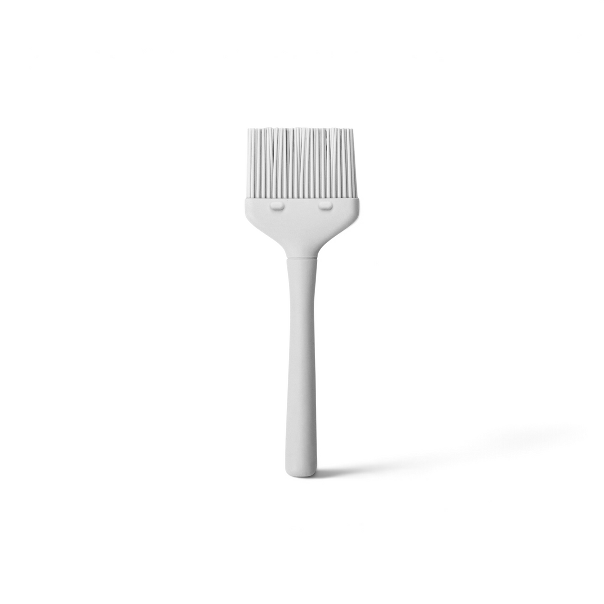 The Flex-Core Basting Brush features a white silicone flat head and a long handle, displayed against a plain white background.